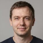 Портрет Марка Стивенса, эксперта по управлению портфелями алгоритмических стейблкоинов в компании Лодос Стим